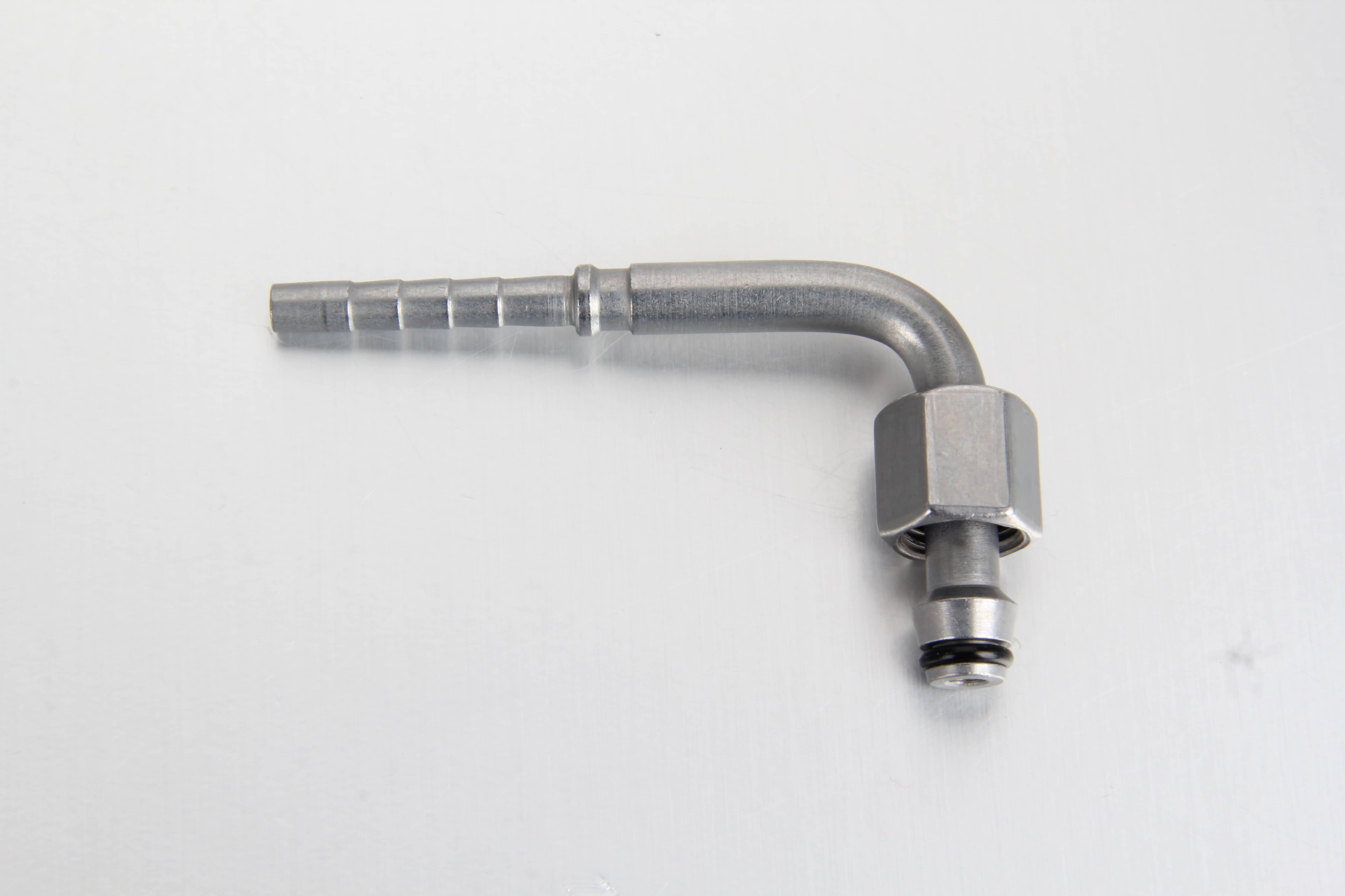A macro detail shot showing the precise internal 24-degree sealing cone and embedded black rubber O-ring inside a 90-degree automatic grease line swivel head.
