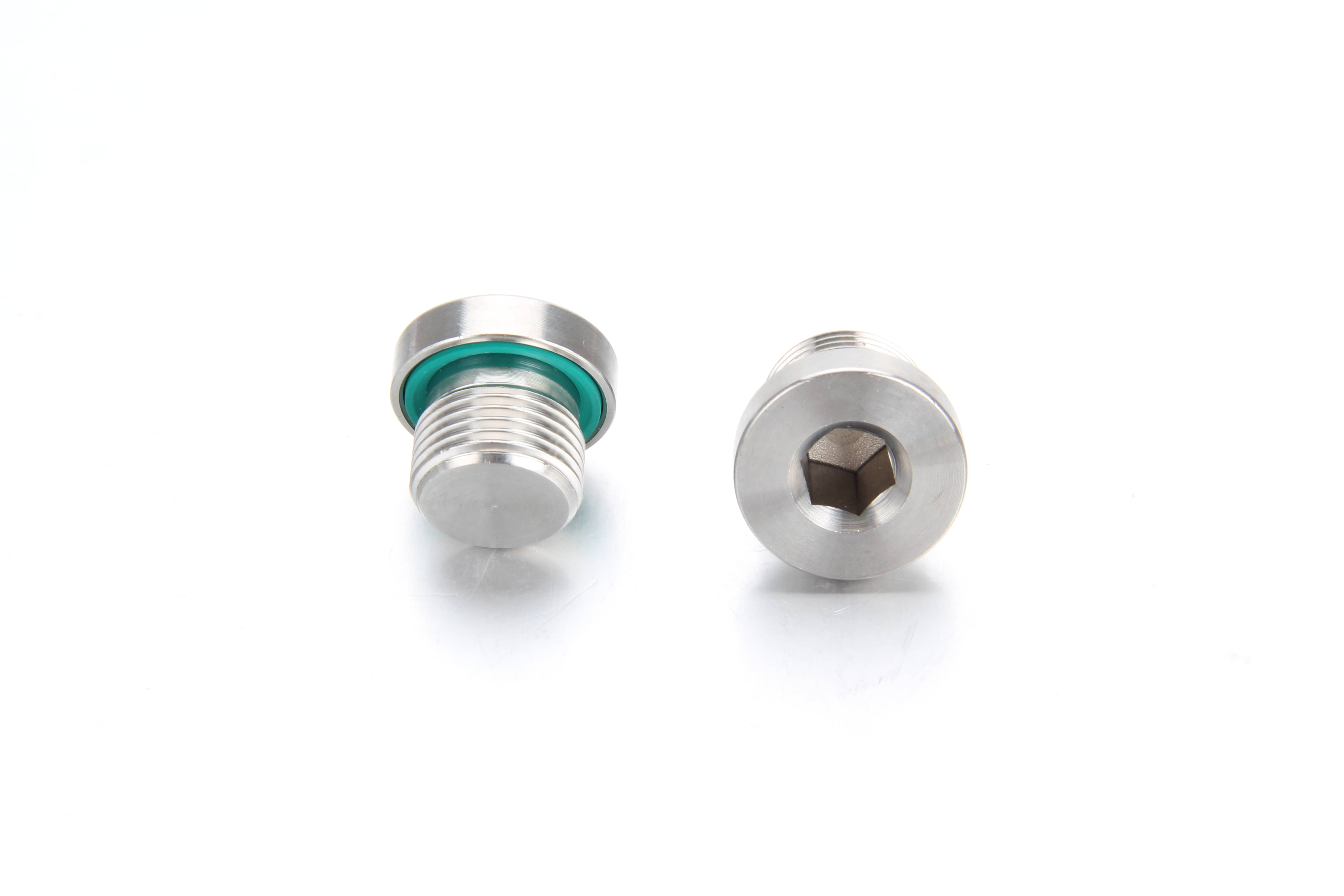 "A custom CNC machined 316L stainless steel plug for cooling manifold block milled down to tight geometric tolerances, featuring multiple integrated distribution fluid ports for direct-to-chip server blade systems."