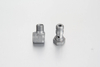 Bulk manufacturing quality control, cross-hole alignment verification, and thread testing of metric compression banjo elbow couplings in an ISO facility.