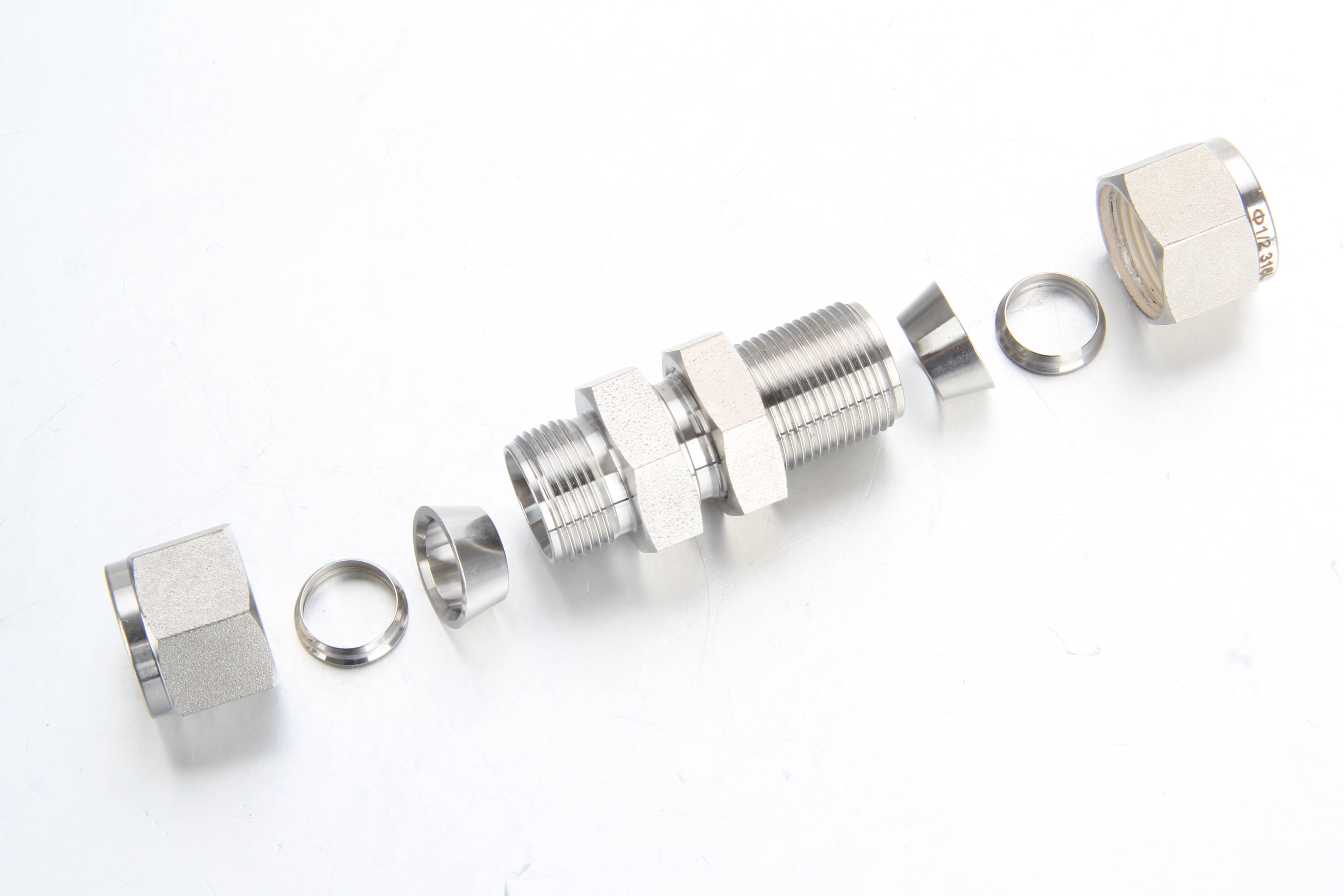 Heavy duty stainless steel bulkhead union compression fitting for panel wall fluid installations.