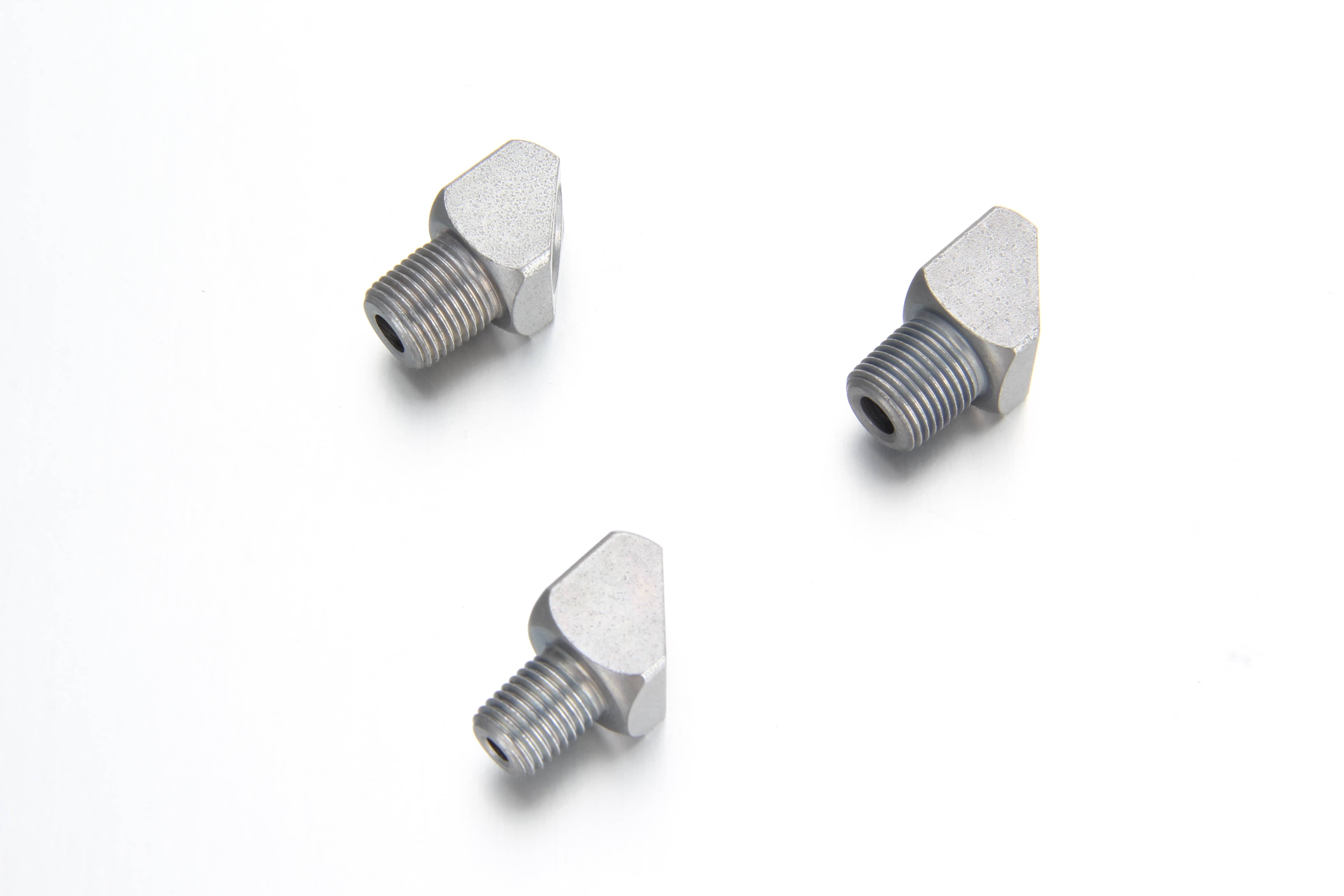 Precision zinc-nickel plated steel 45 degree elbow adapter showing a male tapered thread end and a parallel female thread opening for a central lubrication line.
