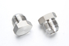 Complete family of thick-walled high pressure stainless steel fittings including forged elbows, tees, and high-pressure hex nipples.