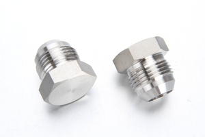 Complete family of thick-walled high pressure stainless steel fittings including forged elbows, tees, and high-pressure hex nipples.
