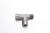 High pressure steel run tee adapter with an ISO 7 male BSPT thread on the run and ISO 1179-1 female BSPP ports for a centralized lubrication system.