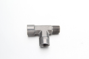 High pressure steel run tee adapter with an ISO 7 male BSPT thread on the run and ISO 1179-1 female BSPP ports for a centralized lubrication system.