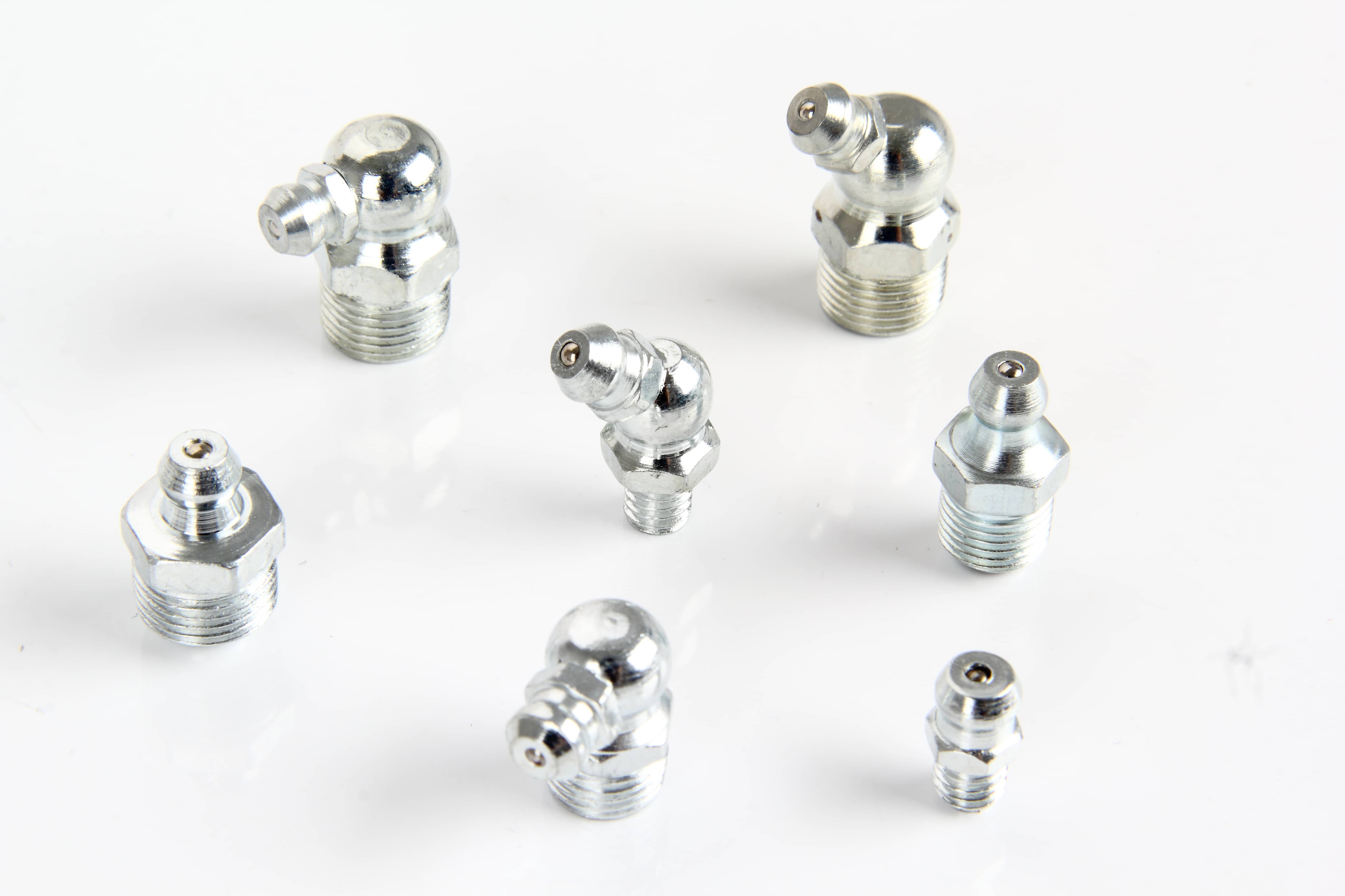 A collection of metal lubrication line fittings including straight, 45 degree, and 90 degree elbow grease nipples by fitsh.cn.