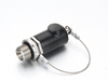 Close up view of the mechanical raised push button on a railway quick release pressure test socket.