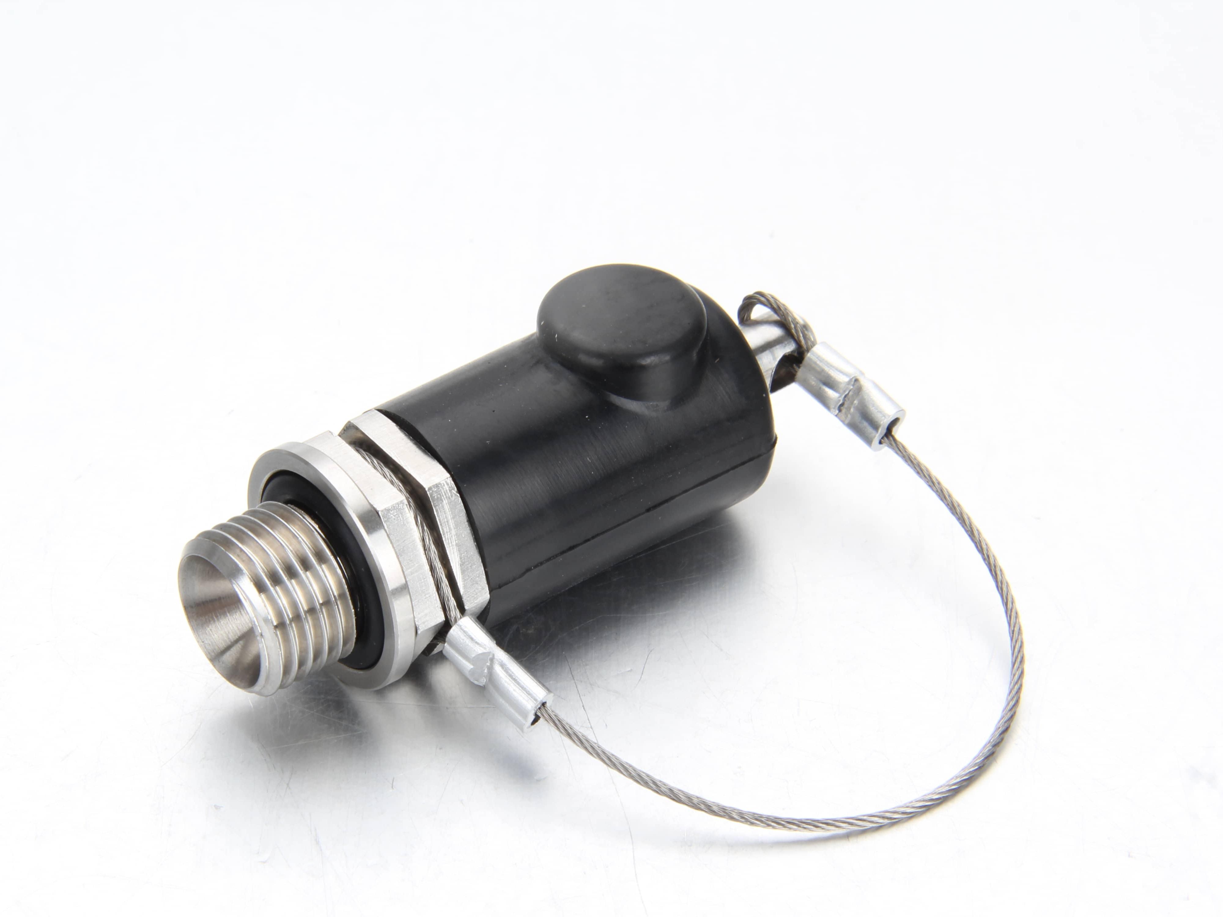 Close up view of the mechanical raised push button on a railway quick release pressure test socket.