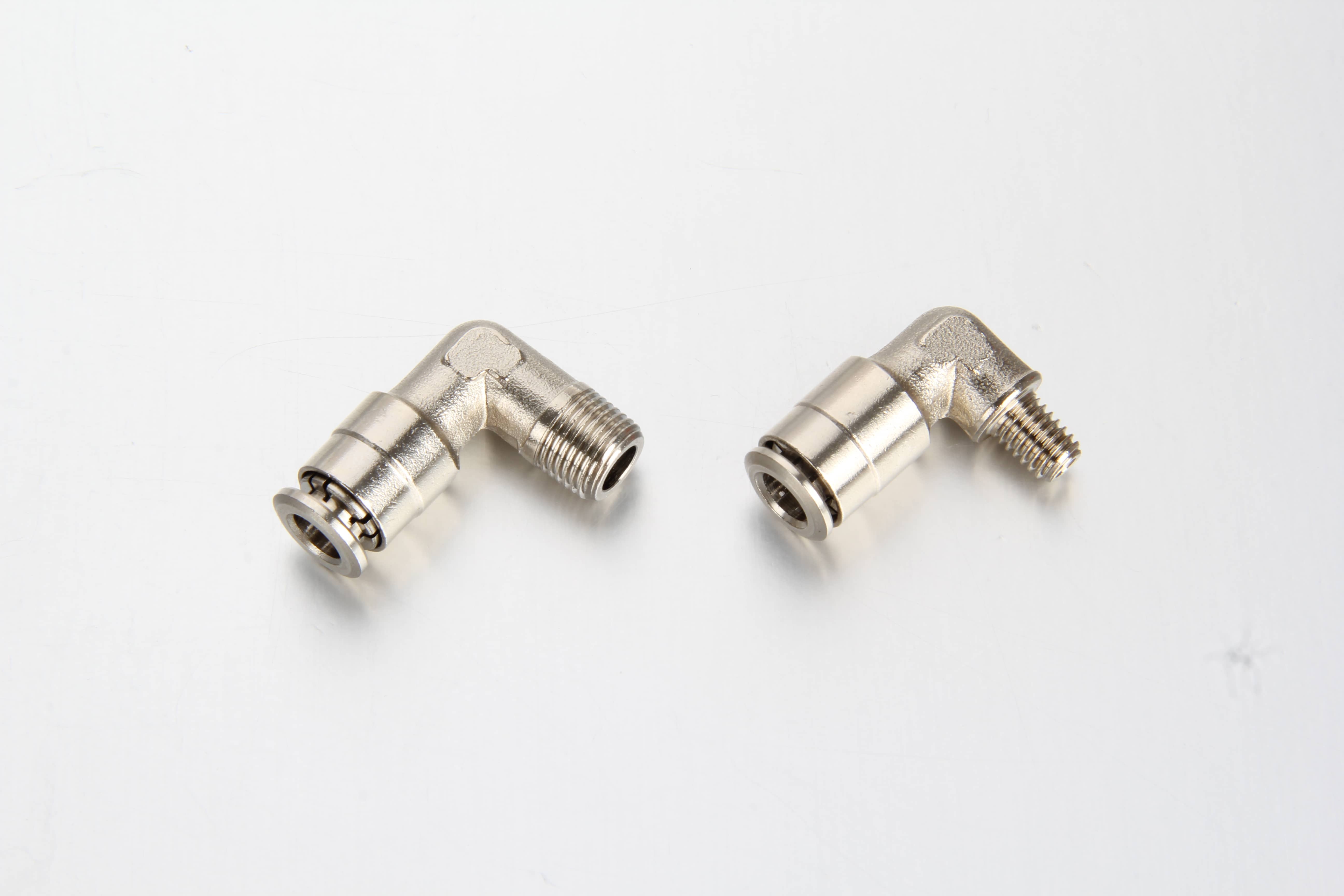 High pressure push in grease elbow male fitting connected securely to a PA12 plastic tube line on an industrial machinery frame