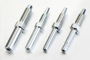 Bulk quality control inspection of galvanized steel, black chromated steel, and stainless steel straight hose studs in an ISO manufacturing facility.