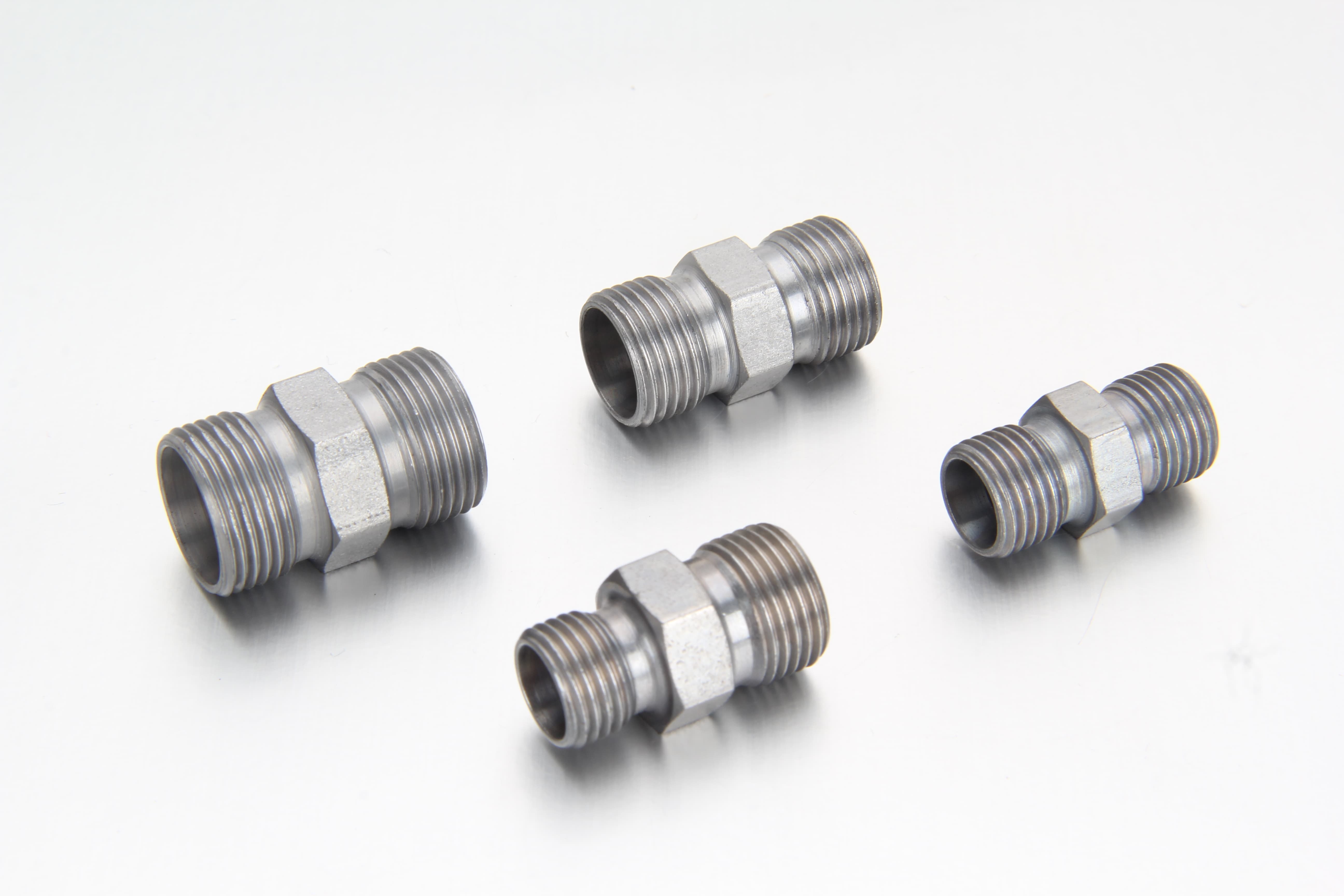 Industrial inspection and continuous oil-pressure endurance testing of symmetric LL series straight union fittings in an ISO-certified facility.