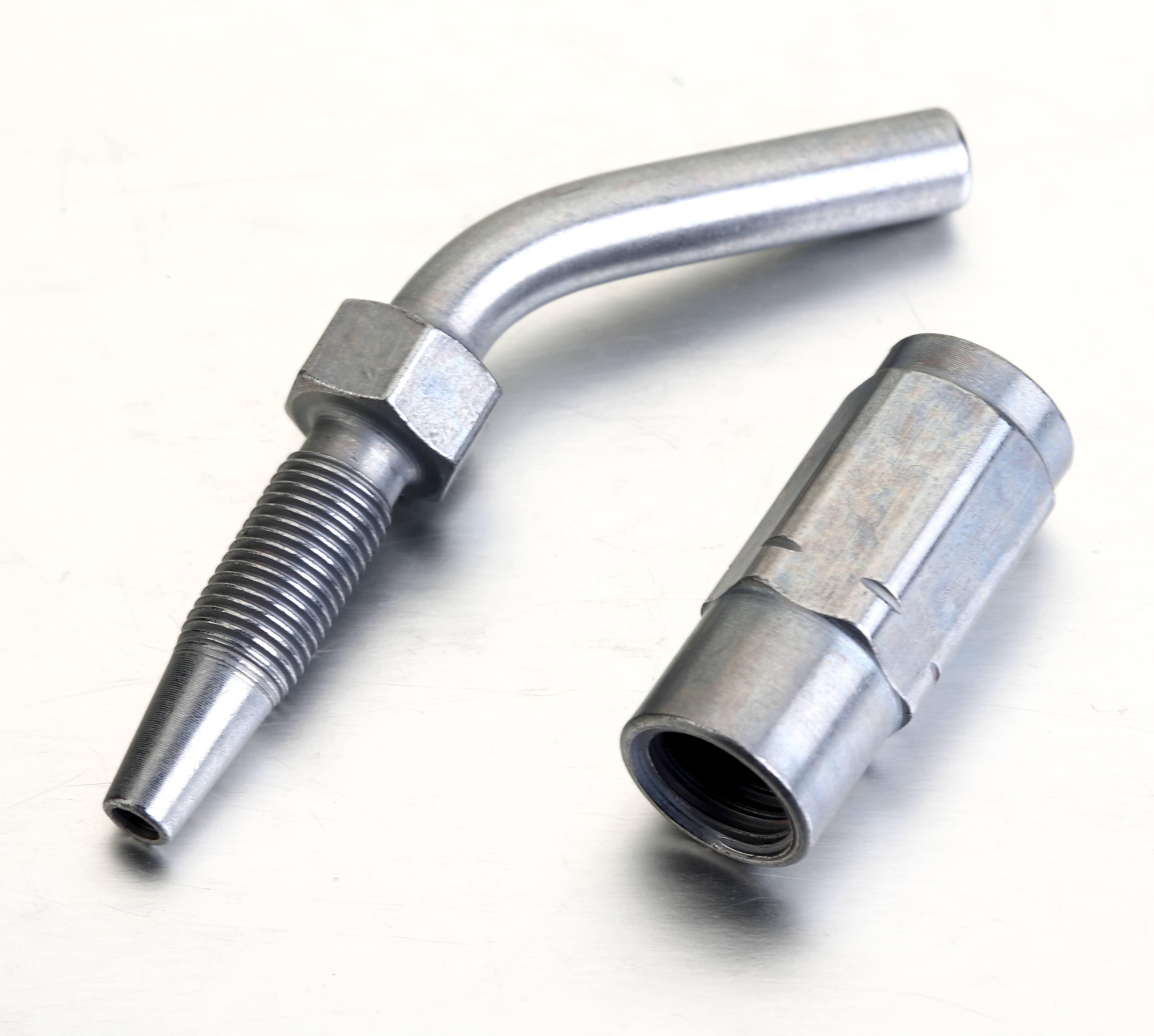 Exploded installation diagram showing a high-pressure grease hose, left-hand thread screw sleeve, and a 45° angled hose stud.