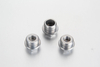 A macro perspective focusing on the flat, sharp concentric sealing collar face at the base of a metric DIN 910 external hex blanking plug