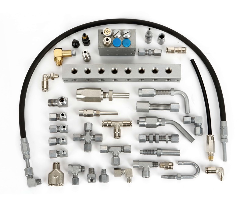 Massive warehouse inventory of progressive block connectors, compression couplings, and central lubrication system fittings manufactured by ISO 9001 factory Ningbo Weichen
