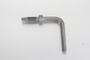 A 90 degree elbow hose stud pipe socket making a sharp right-angle transition on a flexible grease line to clear moving machinery arms.