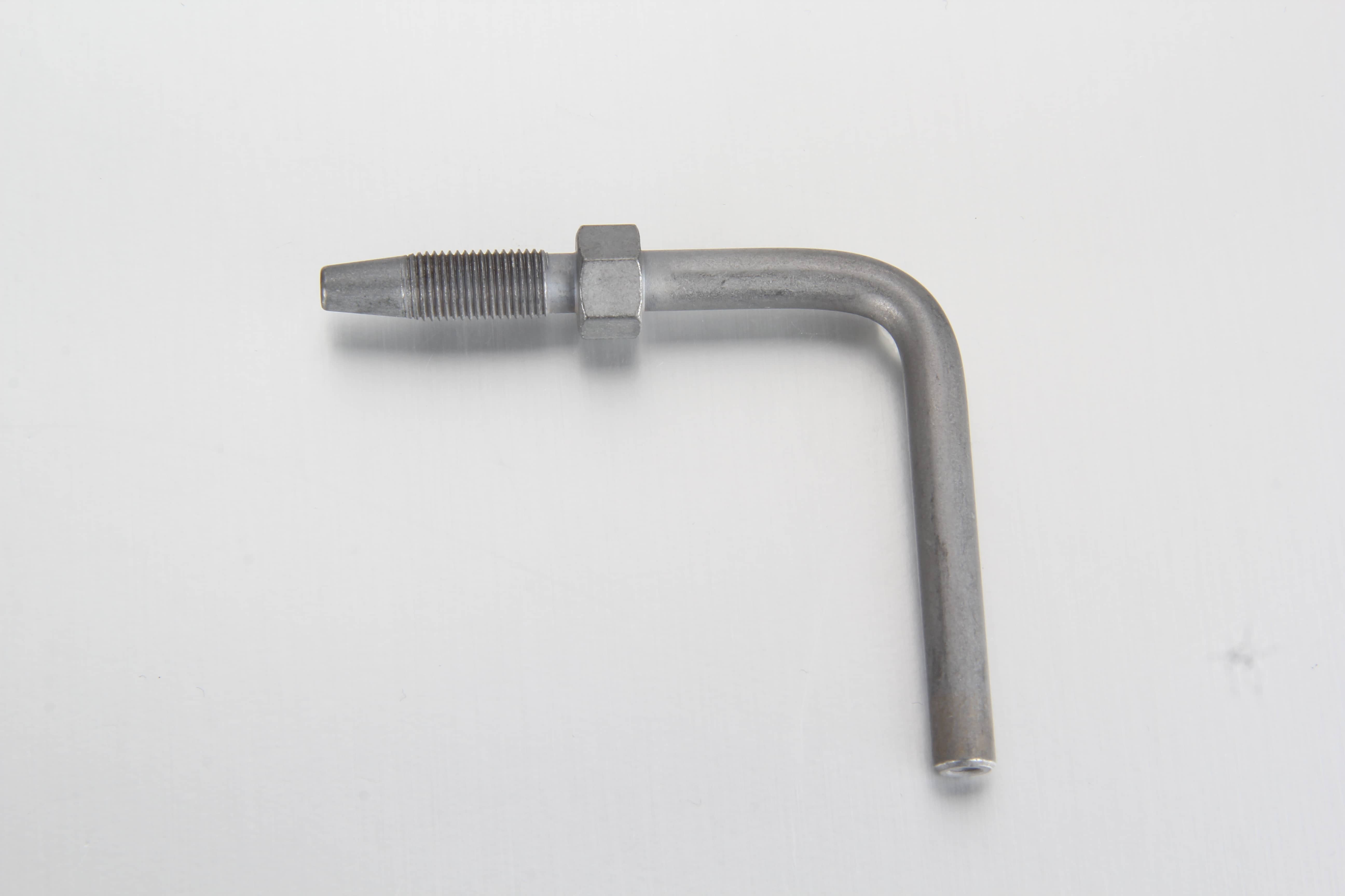 A 90 degree elbow hose stud pipe socket making a sharp right-angle transition on a flexible grease line to clear moving machinery arms.