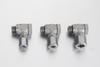 Metric banjo fitting elbow assembly with a hollow male bolt and compression nut for centralized grease line ports.