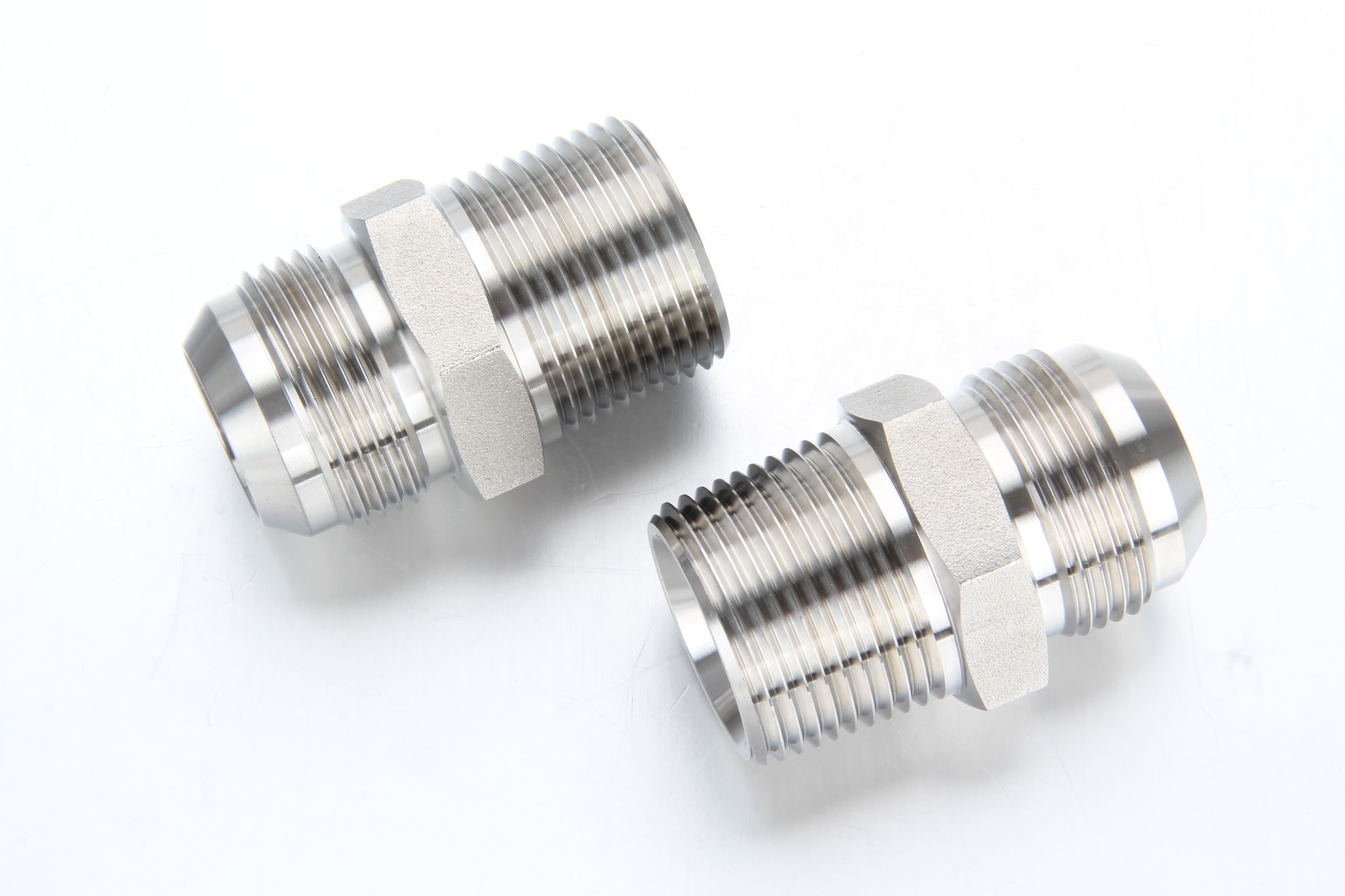 Technical cross-section showcasing the heavy wall thickness and precise internal thread depth designed to withstand 10,000 psi fluid pressure.