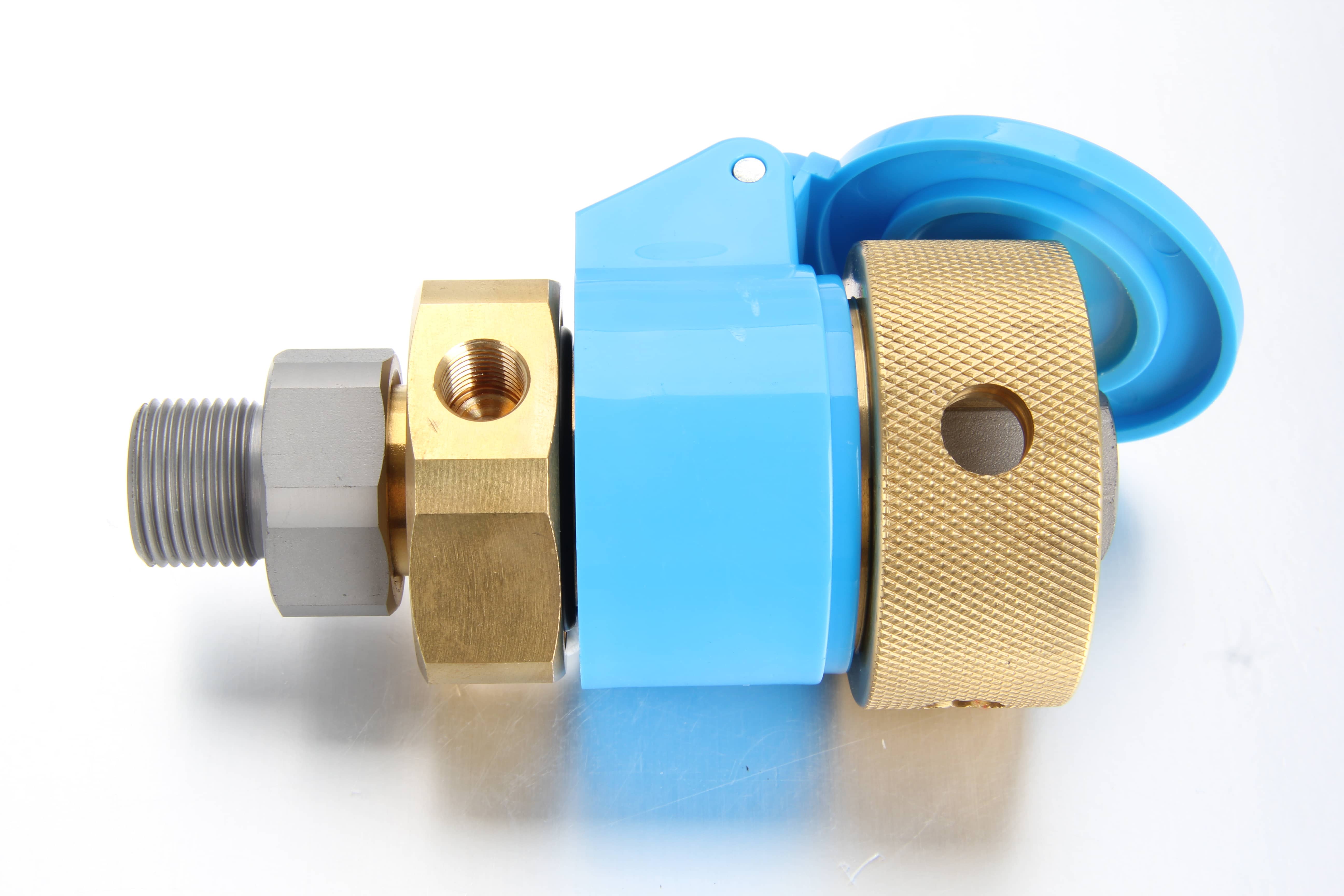 Automated industrial machinery showing a series of custom lubrication sockets with return lines plumbed into a progressive grease distribution block.